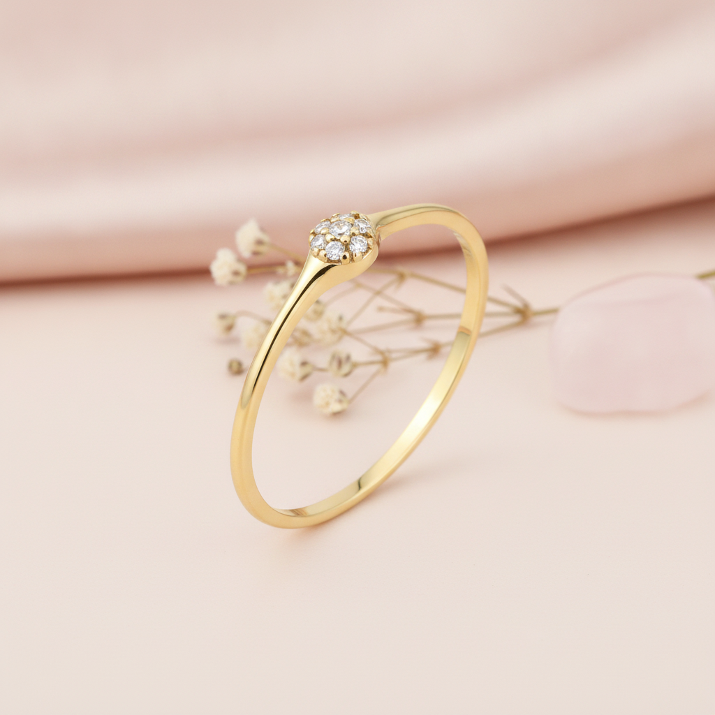 gold cluster ring with a round pave of White CZ stones on blush pink silk with dried baby's breath