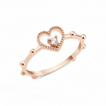 rose gold open heart ring on white background