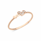 rose gold twin heart ring on white background