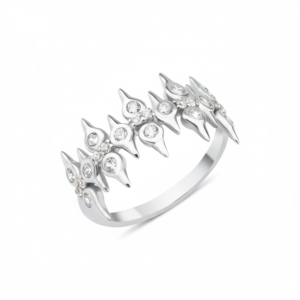 white gold spire crown ring on white background