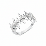 white gold spire crown ring on white background