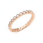 rose gold bezel eternity ring on white background