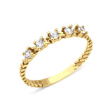 yellow gold rope stack ring on white background