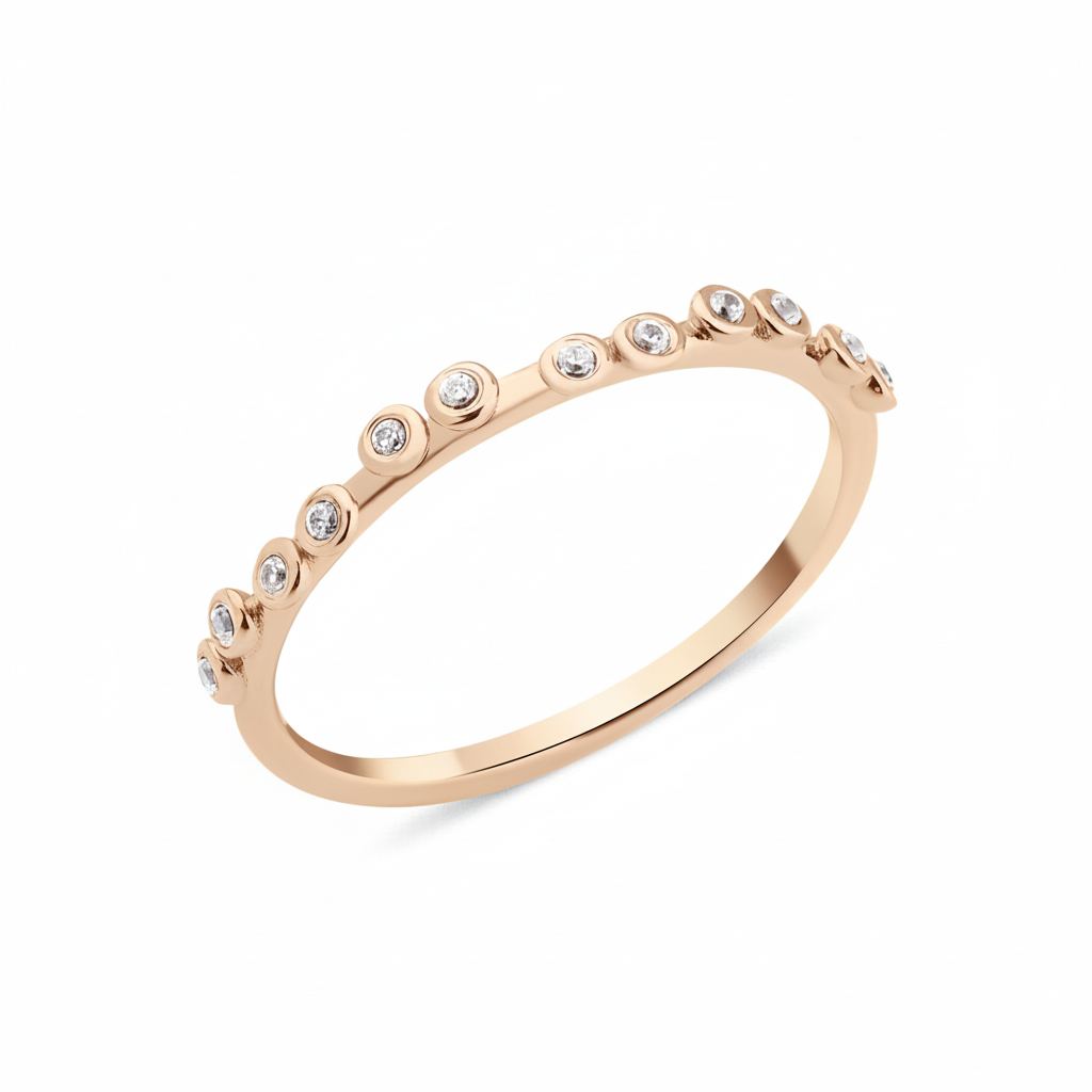 rose gold dotted bezel ring on white background