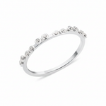 white gold dotted bezel ring on white background