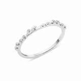 white gold dotted bezel ring on white background