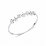 white gold arc bezel ring on white background