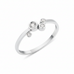 white gold asymmetric orbit ring on white background