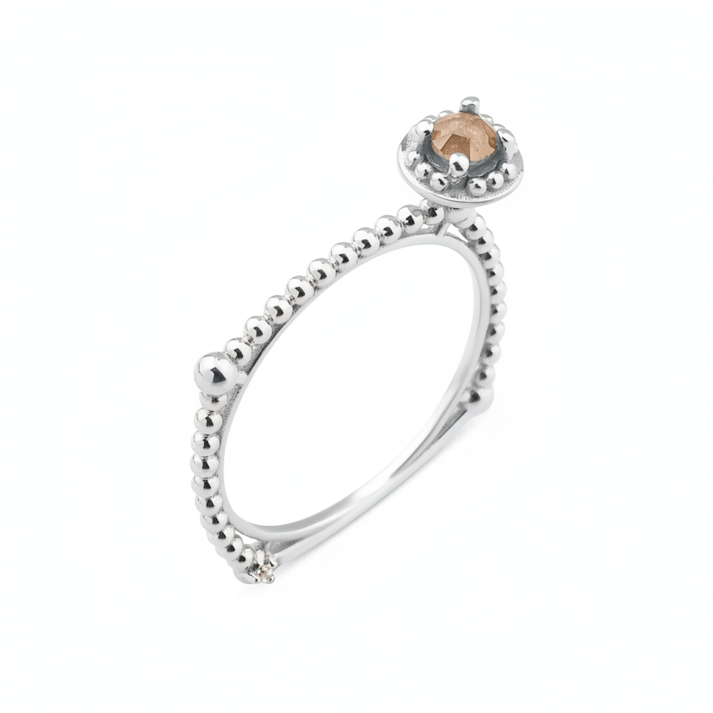 white gold beaded ring with a crowned center stone on white background