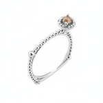 white gold beaded ring with a crowned center stone on white background