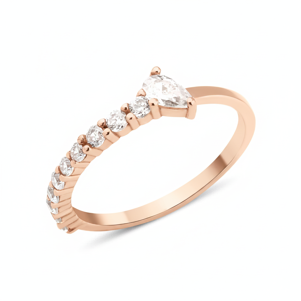 rose gold ring lined with pave stones and a pear-cut stone on white background