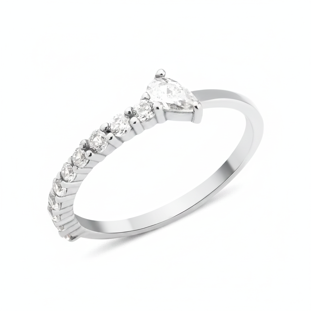 white gold ring lined with pave stones and a pear-cut stone on white background