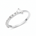 white gold ring lined with pave stones and a pear-cut stone on white background