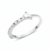 white gold ring lined with pave stones and a pear-cut stone on white background