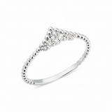 white gold beaded ring with a chevron of pave stones on white background