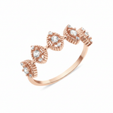 rose gold ring with beaded marquise stations on white background