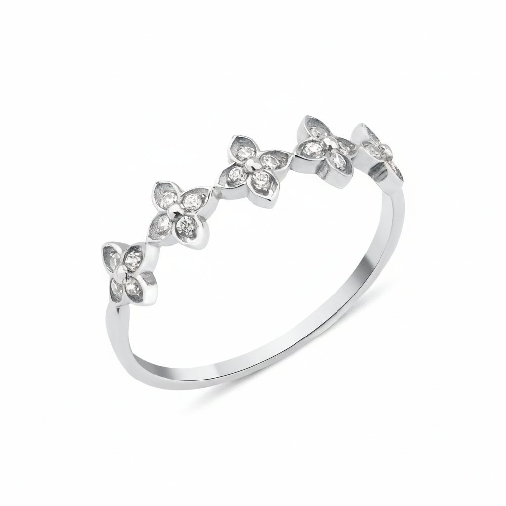 white gold ring with four-petal flower motifs on white background