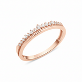 rose gold ring with a crest of pave stones on white background