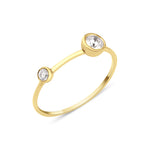 yellow gold open ring with two bezel-set stones on white background