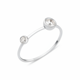 white gold open ring with two bezel-set stones on white background
