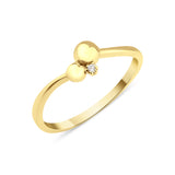 yellow gold ring with two polished spheres and a stone accent on white background
