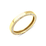 yellow gold ring with a row of pave stones along the edge on white background
