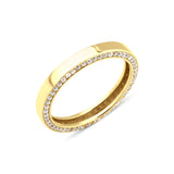 yellow gold ring with a row of pave stones along the edge on white background