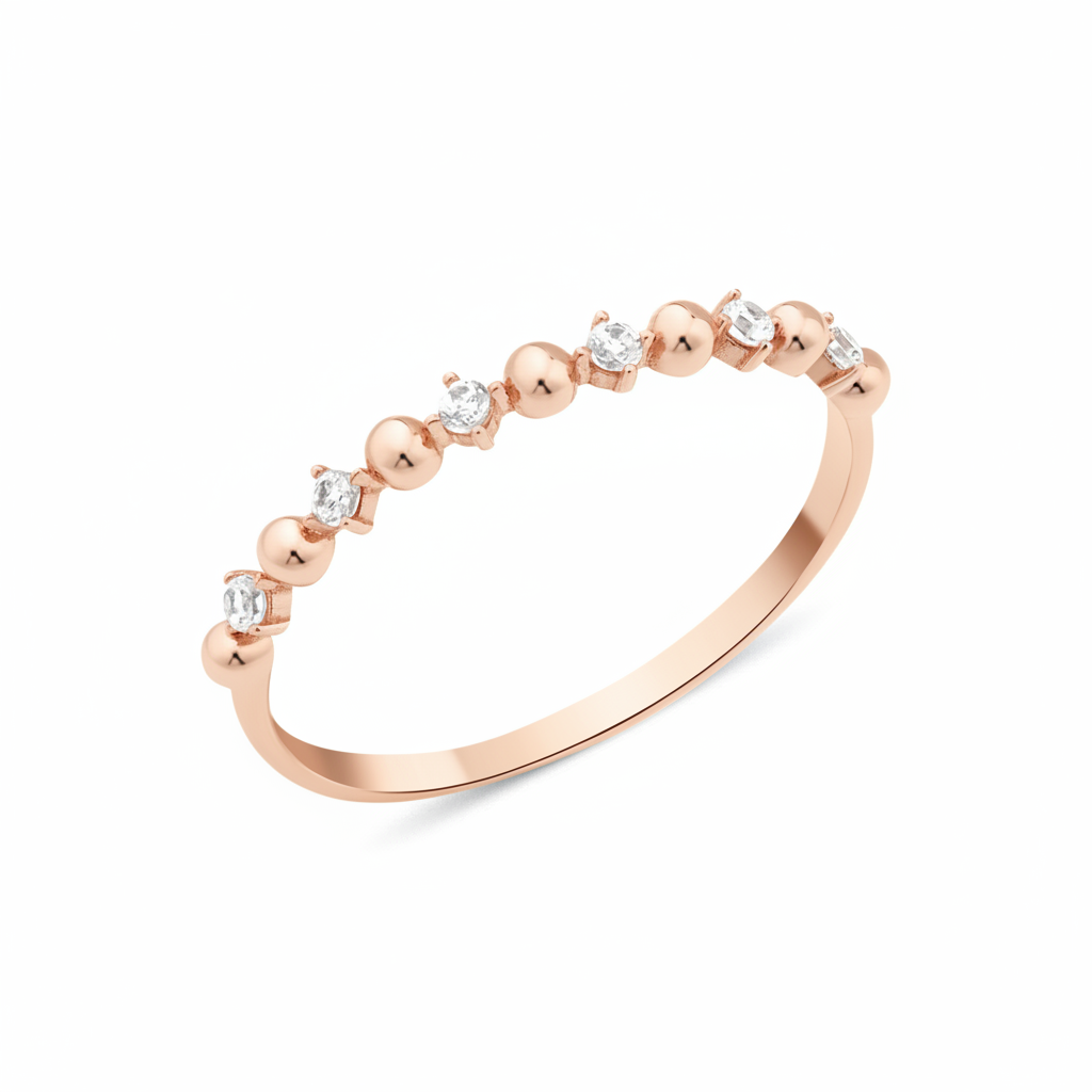 rose gold ring with alternating beads and stones on white background