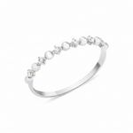 white gold ring with alternating beads and stones on white background