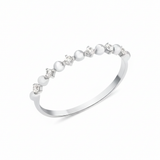 white gold ring with alternating beads and stones on white background