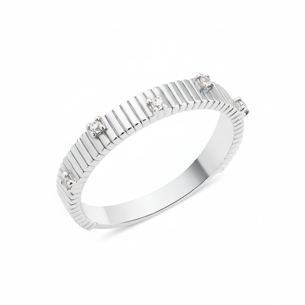 white gold ribbed ring set with clear stones on white background