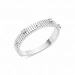 white gold ribbed ring set with clear stones on white background
