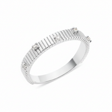 white gold ribbed ring set with clear stones on white background