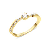 yellow gold ring with a channel of stones and a crowned center stone on white background