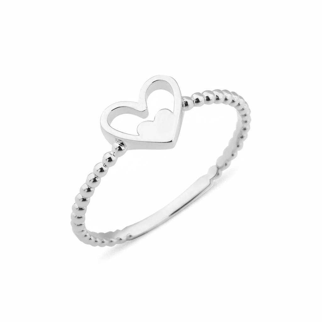 white gold ring with a nested heart motif on white background