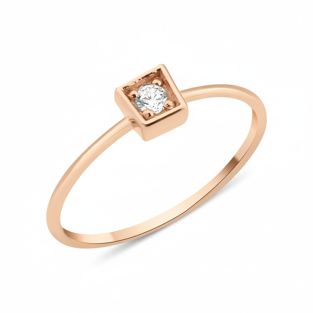 rose gold ring with a stone set in a square frame on white background