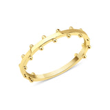 yellow gold ring with raised beaded texture on white background