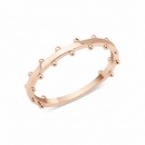 rose gold ring with raised beaded texture on white background