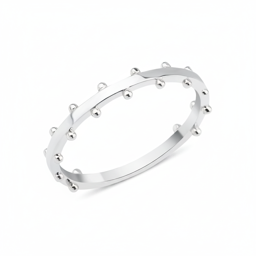 white gold ring with raised beaded texture on white background