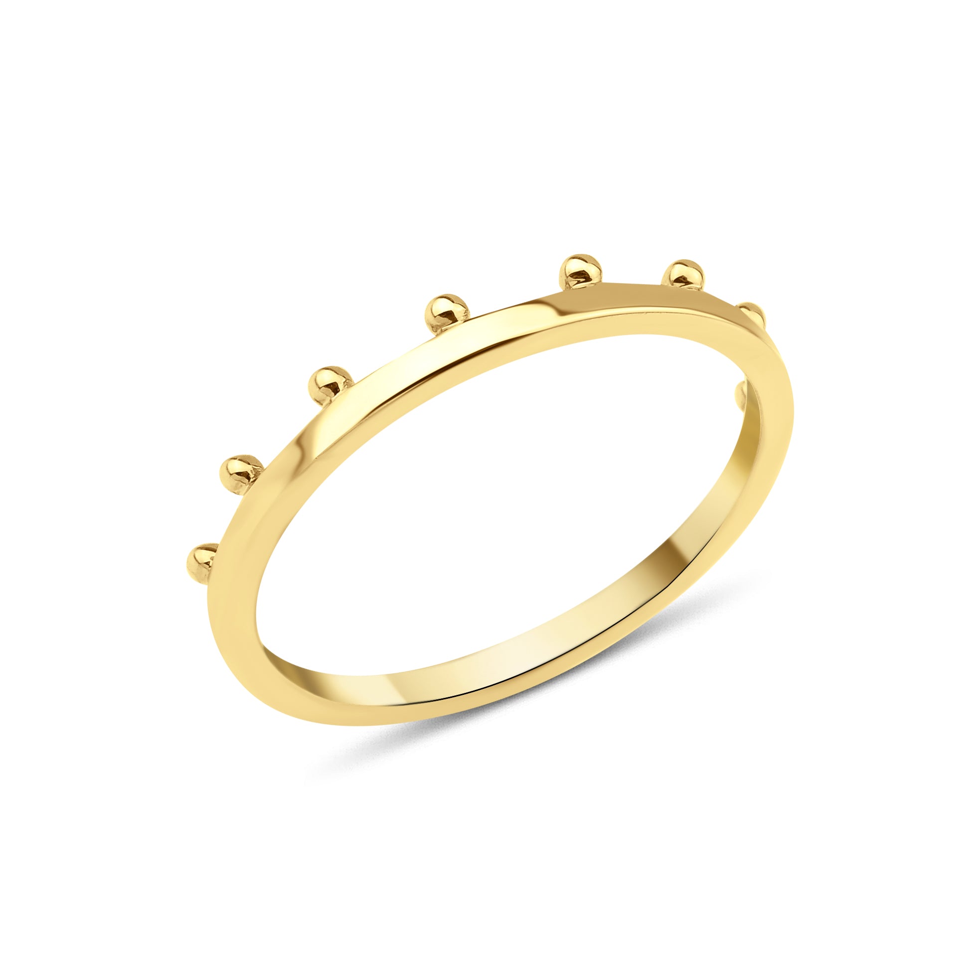 yellow gold ring with raised golden spheres along the edge on white background