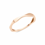 rose gold ring with an undulating wave design on white background