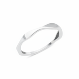 white gold ring with an undulating wave design on white background