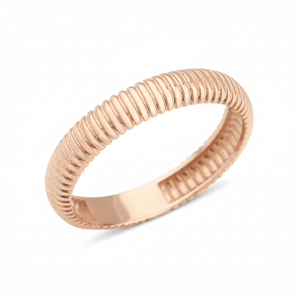 rose gold ring with fine ribbed texture on white background