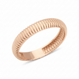 rose gold ring with fine ribbed texture on white background