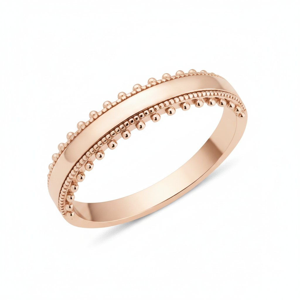 rose gold ring with a beaded ribbon texture on white background