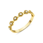 yellow gold Aurelia station ring on a white background