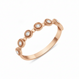 rose gold Aurelia station ring on a white background
