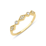 yellow gold Solene station ring on a white background