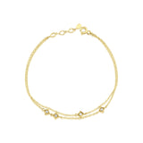 yellow gold double chain bracelet with square stone stations on white background