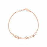 rose gold double chain bracelet with square stone stations on white background